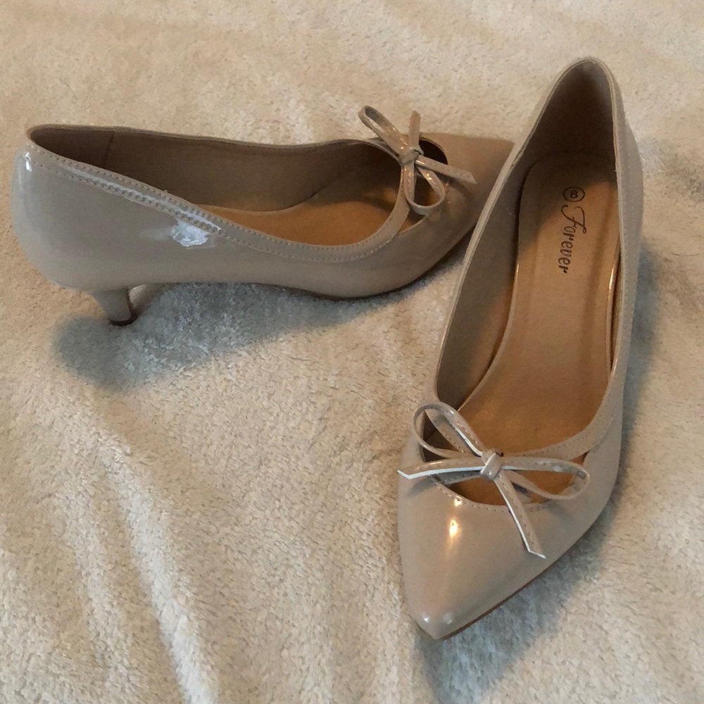 Pink mini-heels with bow detail